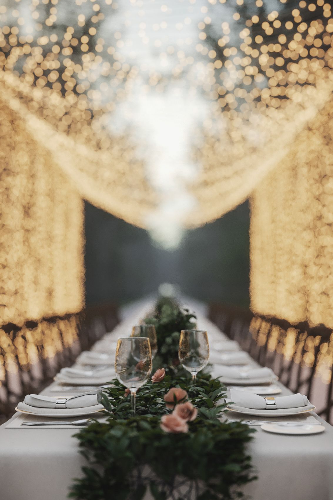 Portrait view down an illuminated dining table