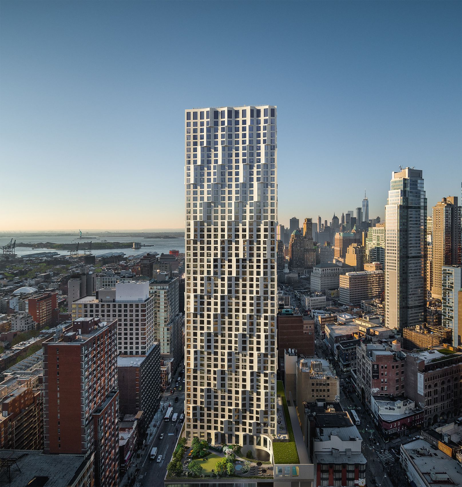 Tall urban residential tower seen above the surrounding city